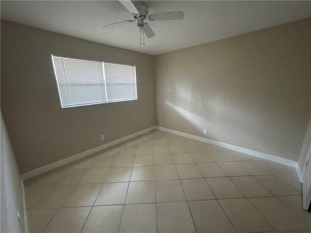 550 Southeast 2nd Avenue, Unit G5 Deerfield Beach, FL 33441 - Photo 12 of 28 a view of an empty room with a window