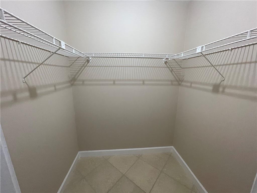 550 Southeast 2nd Avenue, Unit G5 Deerfield Beach, FL 33441 - Photo 13 of 28 a view of a room with racks on the wall