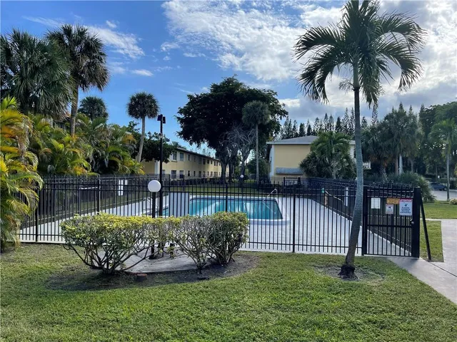 a view of a backyard with garden