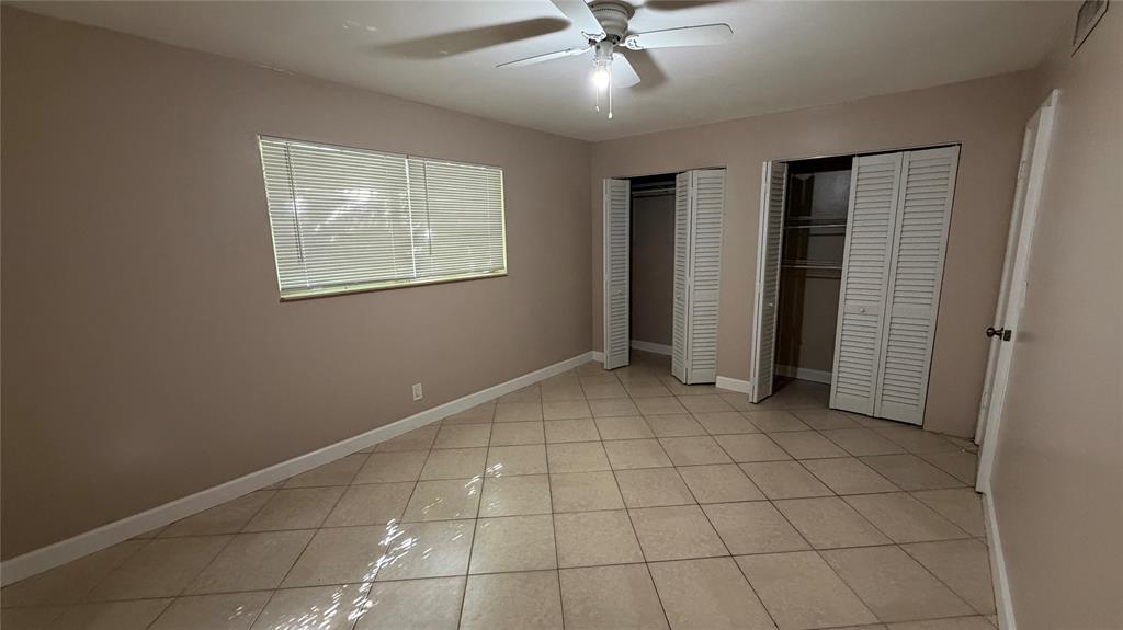 550 Southeast 2nd Avenue, Unit G5 Deerfield Beach, FL 33441 - Photo 27 of 28 a view of an empty room with a window