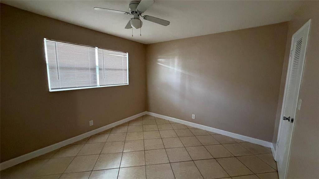 550 Southeast 2nd Avenue, Unit G5 Deerfield Beach, FL 33441 - Photo 28 of 28 a view of an empty room with a window