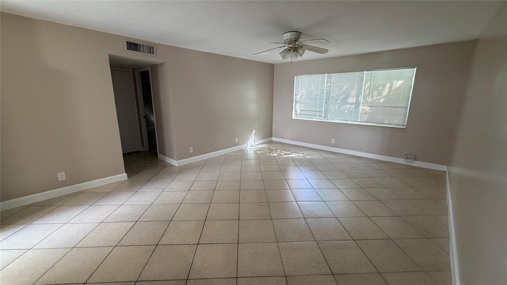 550 Southeast 2nd Avenue, Unit G5 Deerfield Beach, FL 33441 - Photo 8 of 28 a view of an empty room with a window
