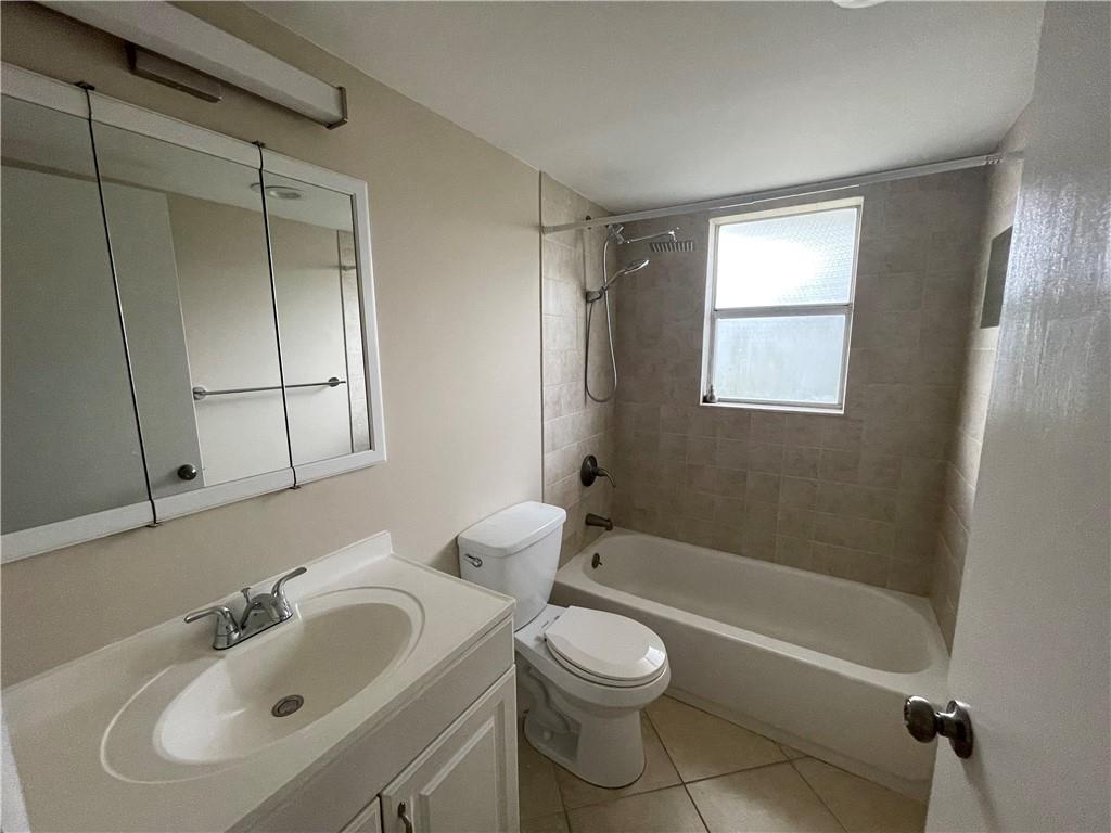 550 Southeast 2nd Avenue, Unit G5 Deerfield Beach, FL 33441 - Photo 9 of 28 a bathroom with a sink toilet and shower