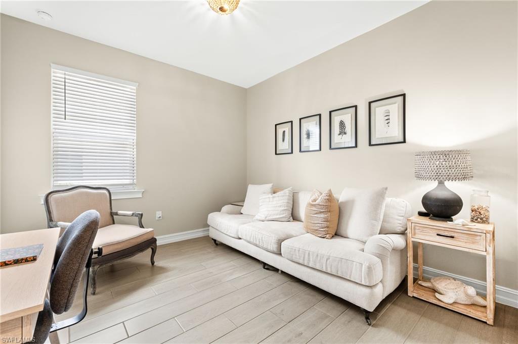 14546 Tropical Drive Naples, FL 34114 - Photo 20 of 39 a living room with furniture and a window
