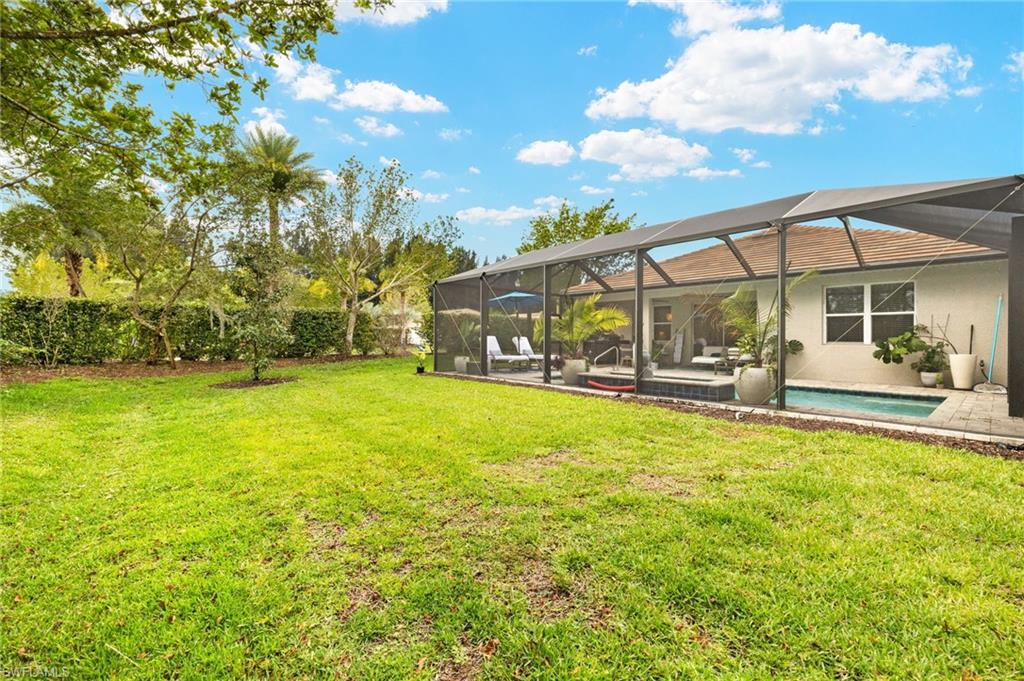 14546 Tropical Drive Naples, FL 34114 - Photo 26 of 39 a view of swimming pool with outdoor seating and yard
