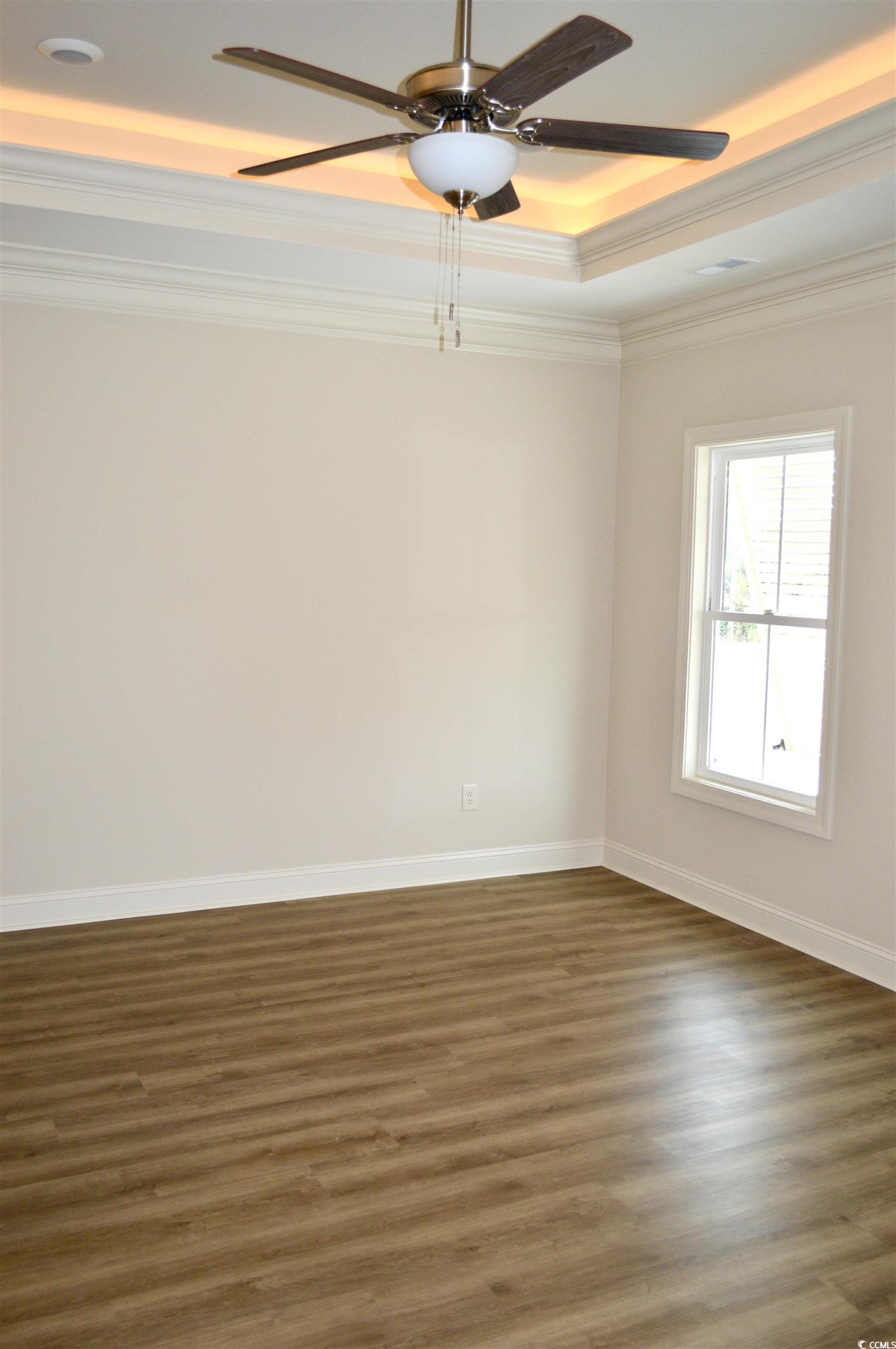 110 Hallandale Lane Murrells Inlet, SC 29576 - Photo 11 of 37 Owner's bedroom with a raised ceiling, ceiling fan, and crown molding