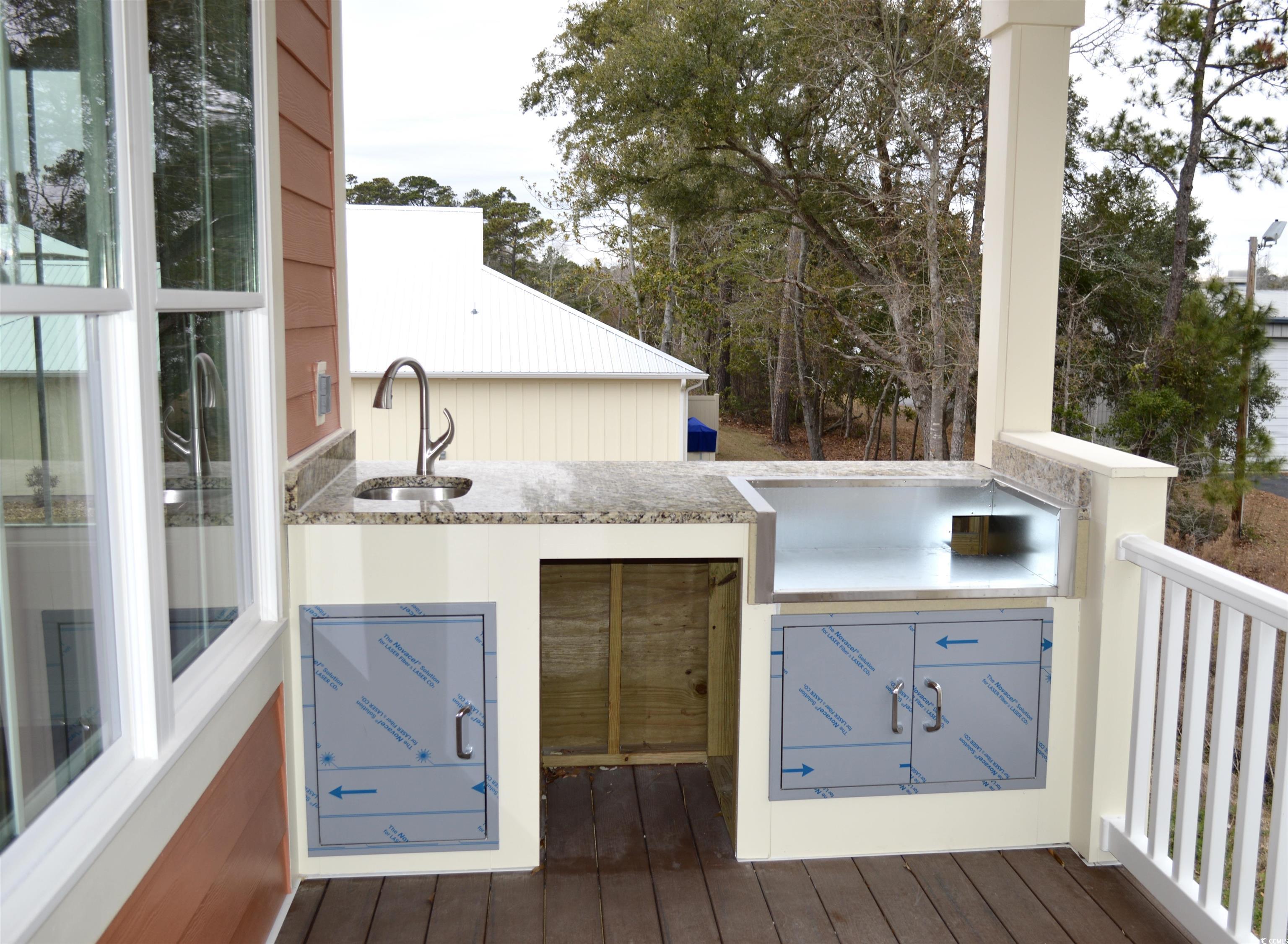 110 Hallandale Lane Murrells Inlet, SC 29576 - Photo 23 of 37 Upstairs deck and outdoor grill/kitchen