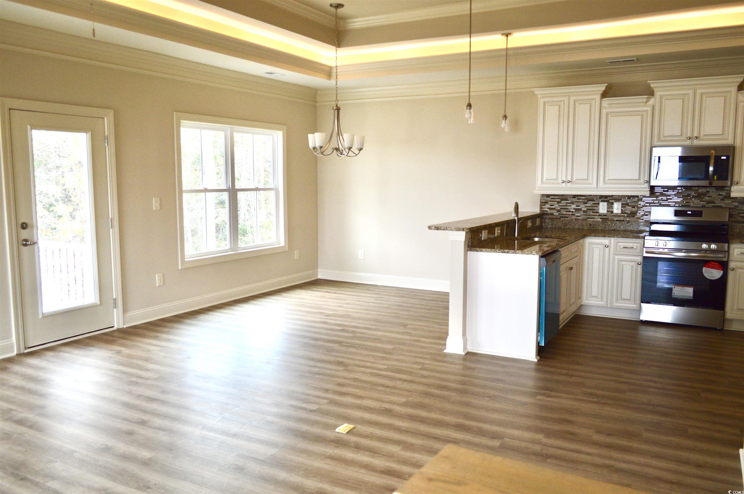 110 Hallandale Lane Murrells Inlet, SC 29576 - Photo 6 of 37 Open living and dining area