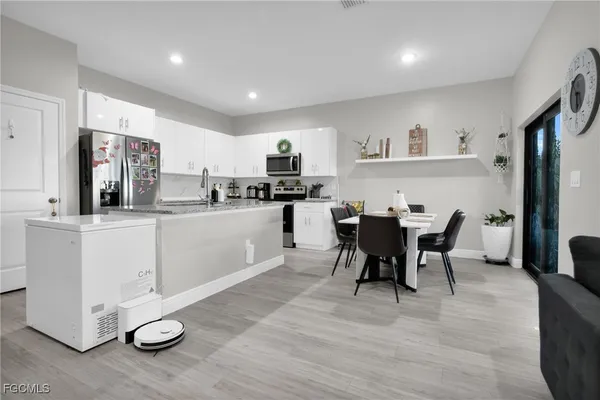 a bedroom with a bed and a cabinets