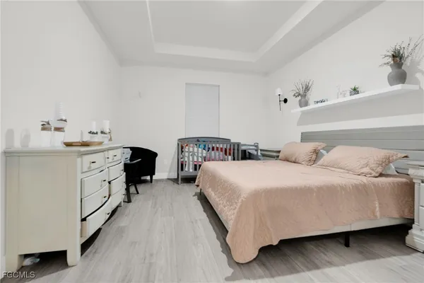 a bedroom with a bed and dresser