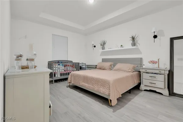 a bathroom with a granite countertop toilet a sink and a mirror