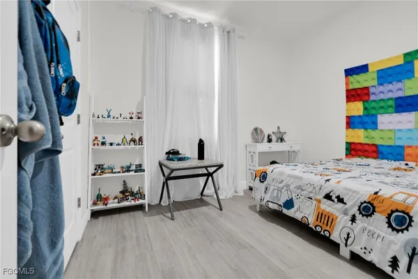 a view of an entryway with wooden floor