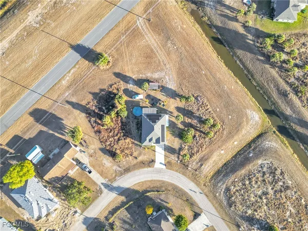 view of a house with a yard and sitting area