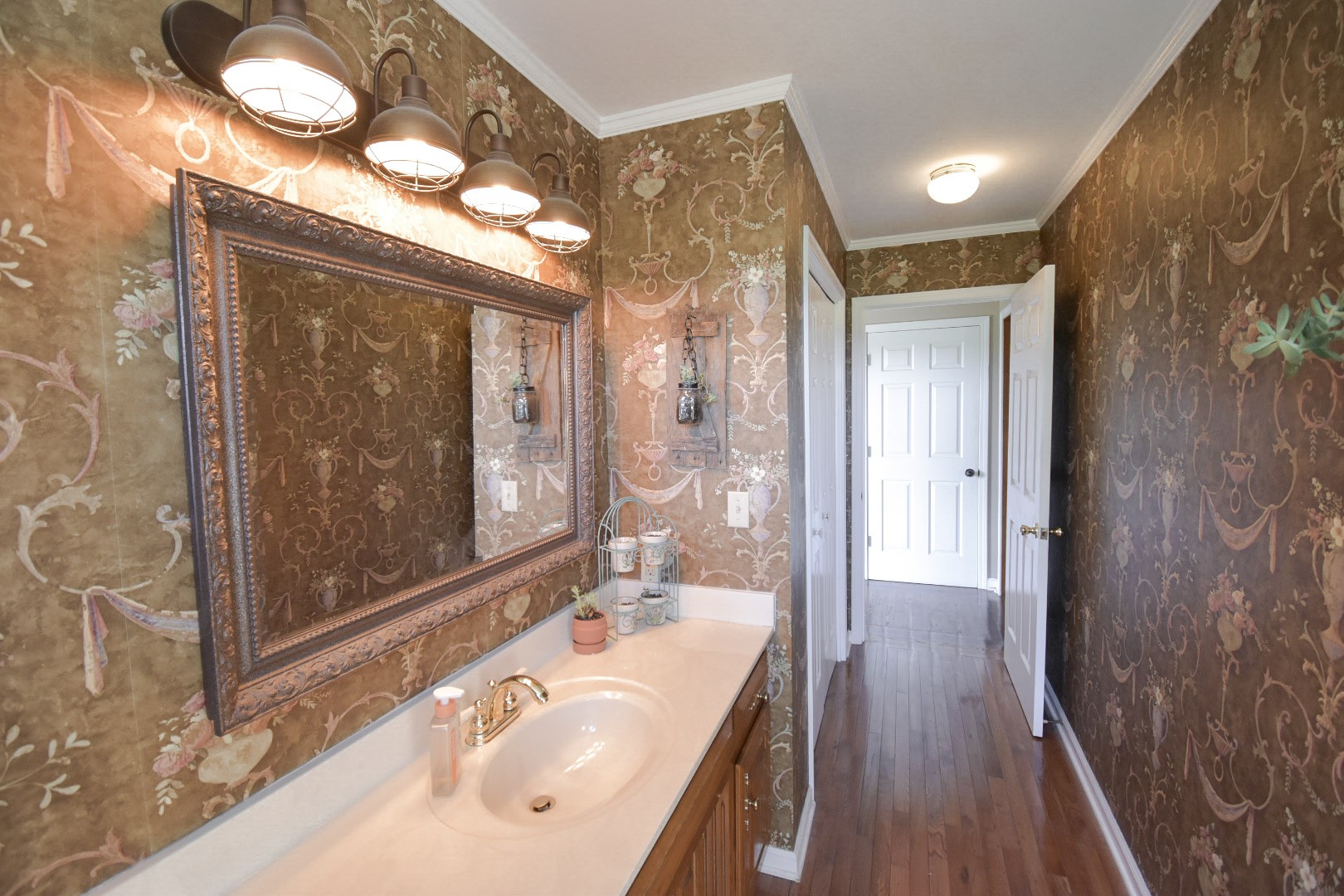 10814 Clarksville Road Olmstead, KY 42265 - Photo 10 of 55 a bathroom with a sink a mirror and a shower