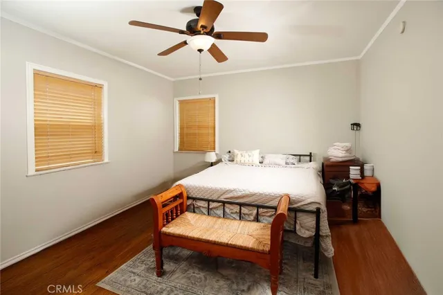 a dining room with a wooden table and chairs