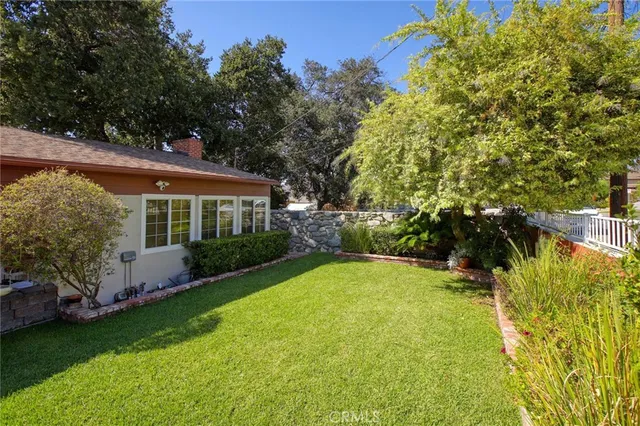 a view of backyard with swimming pool