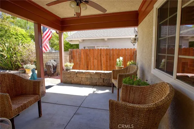 a living room filled with furniture and a potted plant