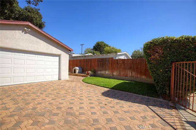 a view of backyard with green space