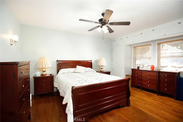 a bedroom with a bed and a dresser