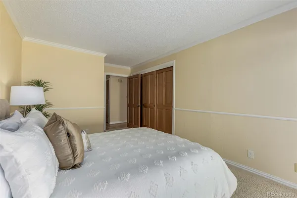 an empty room with closet area