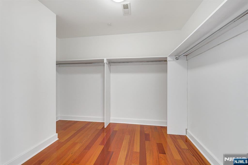 22 Vela Way Edgewater, NJ 07020 - Photo 17 of 43 a view of room with wooden floor
