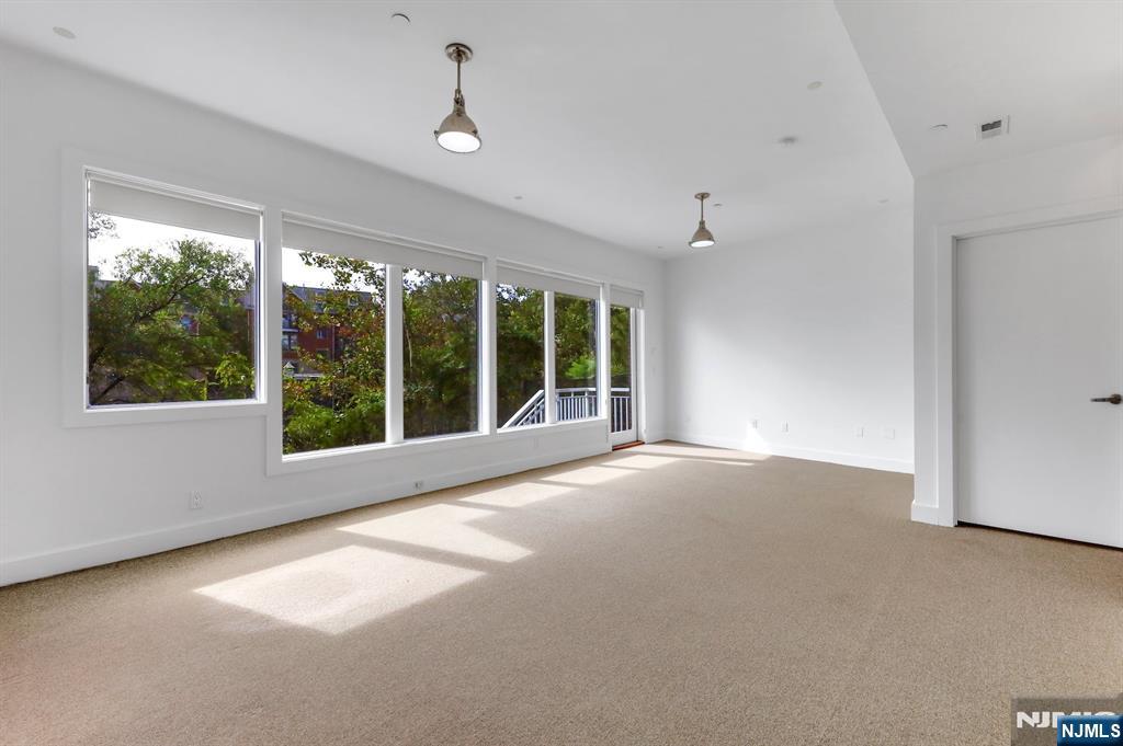 22 Vela Way Edgewater, NJ 07020 - Photo 28 of 43 a view of an empty room with a window