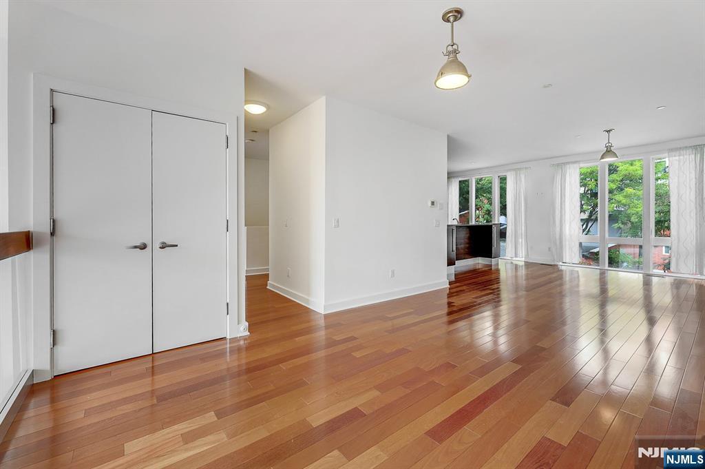 22 Vela Way Edgewater, NJ 07020 - Photo 8 of 43 wooden floor in an empty room with a window
