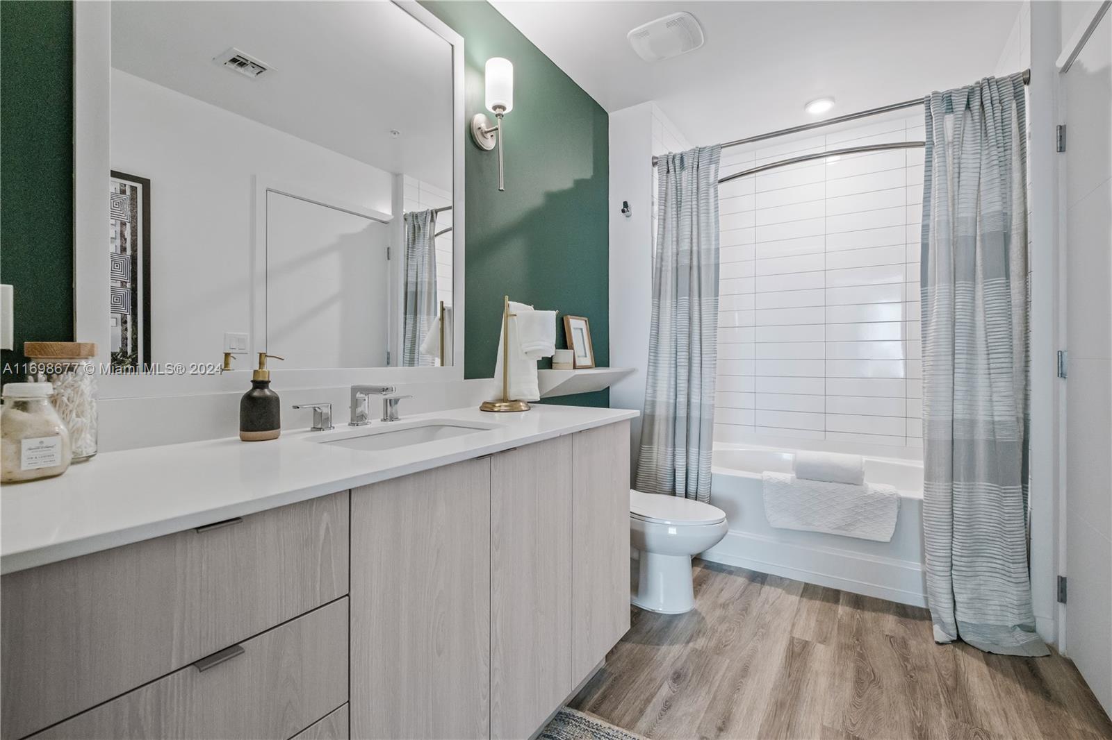 1919 Southeast 10th Avenue, Unit 2121 Fort Lauderdale, FL 33316 - Photo 19 of 35 a bathroom with a double vanity sink toilet and shower