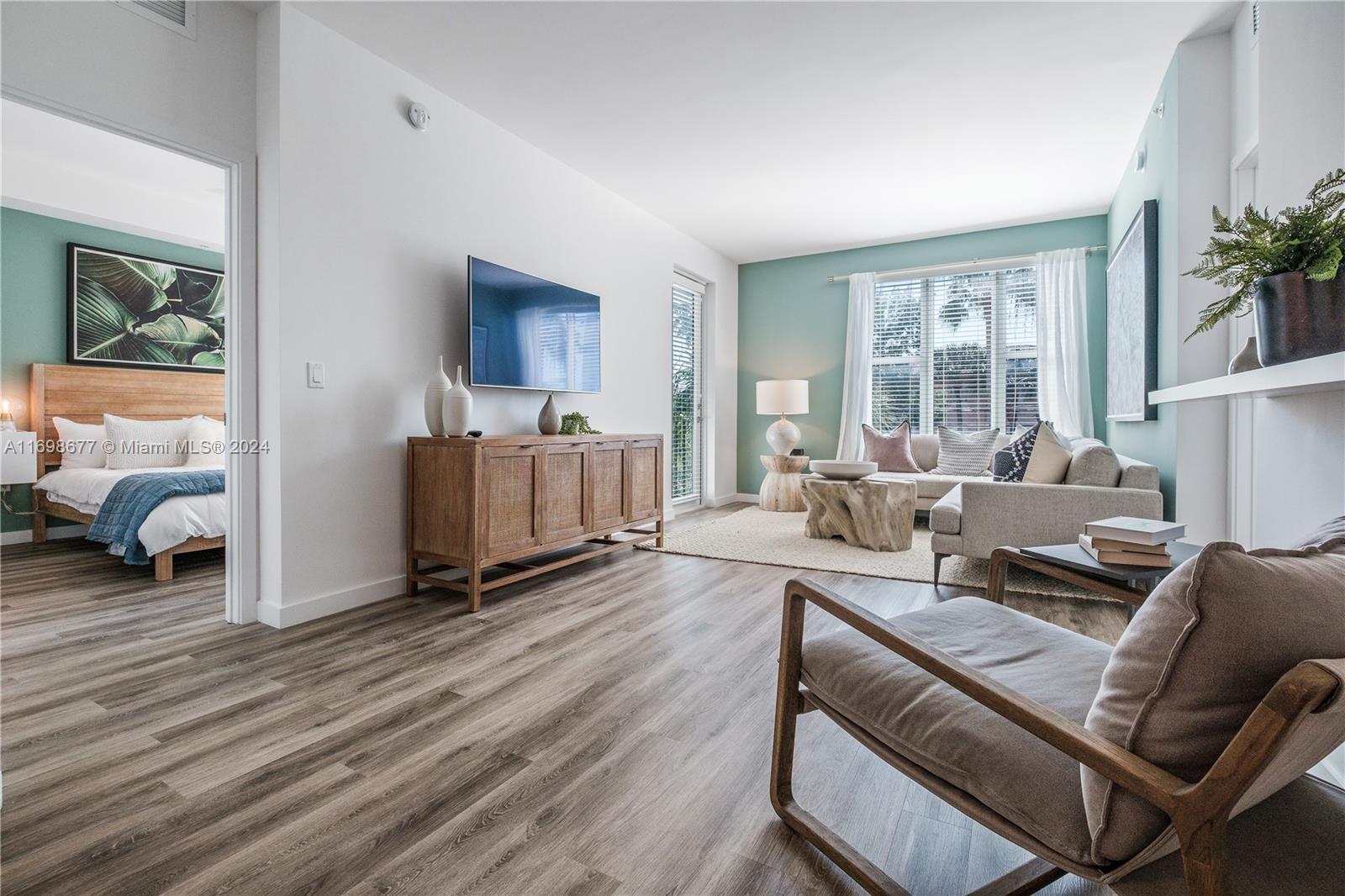 1919 Southeast 10th Avenue, Unit 2121 Fort Lauderdale, FL 33316 - Photo 27 of 35 a living room with furniture and a large window