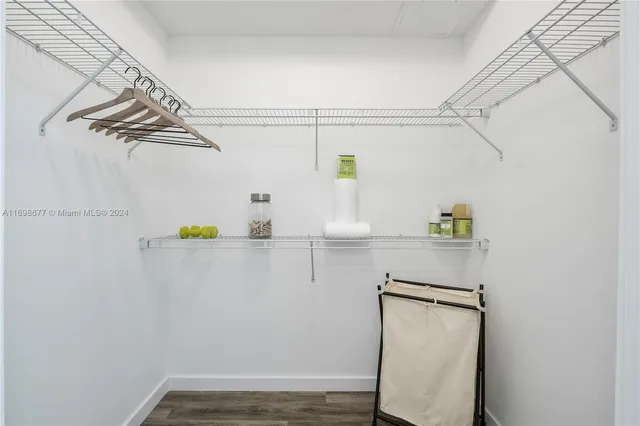 a view of hallway with wooden floor