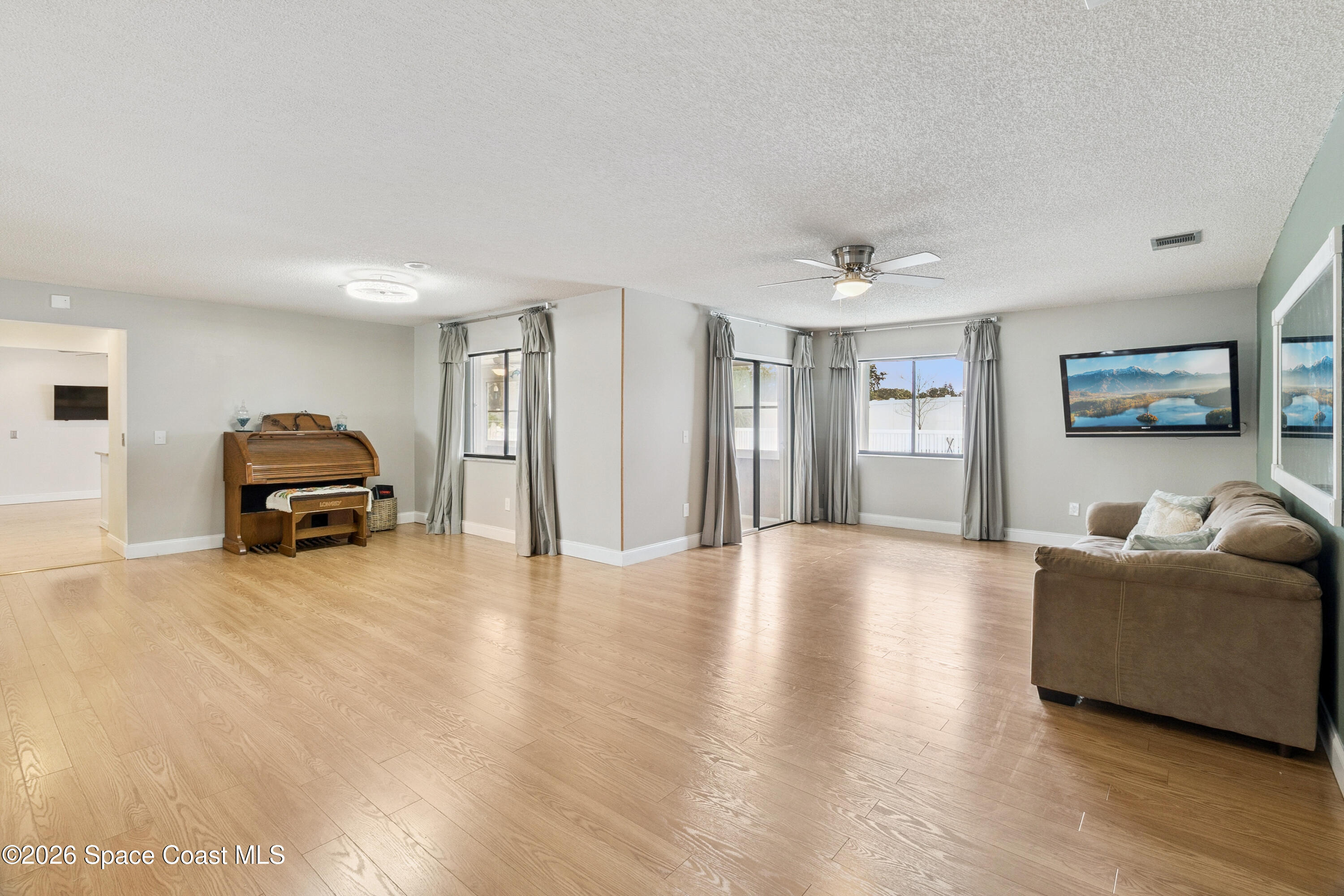 1334 Cherry Hills Road Northeast Palm Bay, FL 32905 - Photo 8 of 58 Living Room/Dining Room