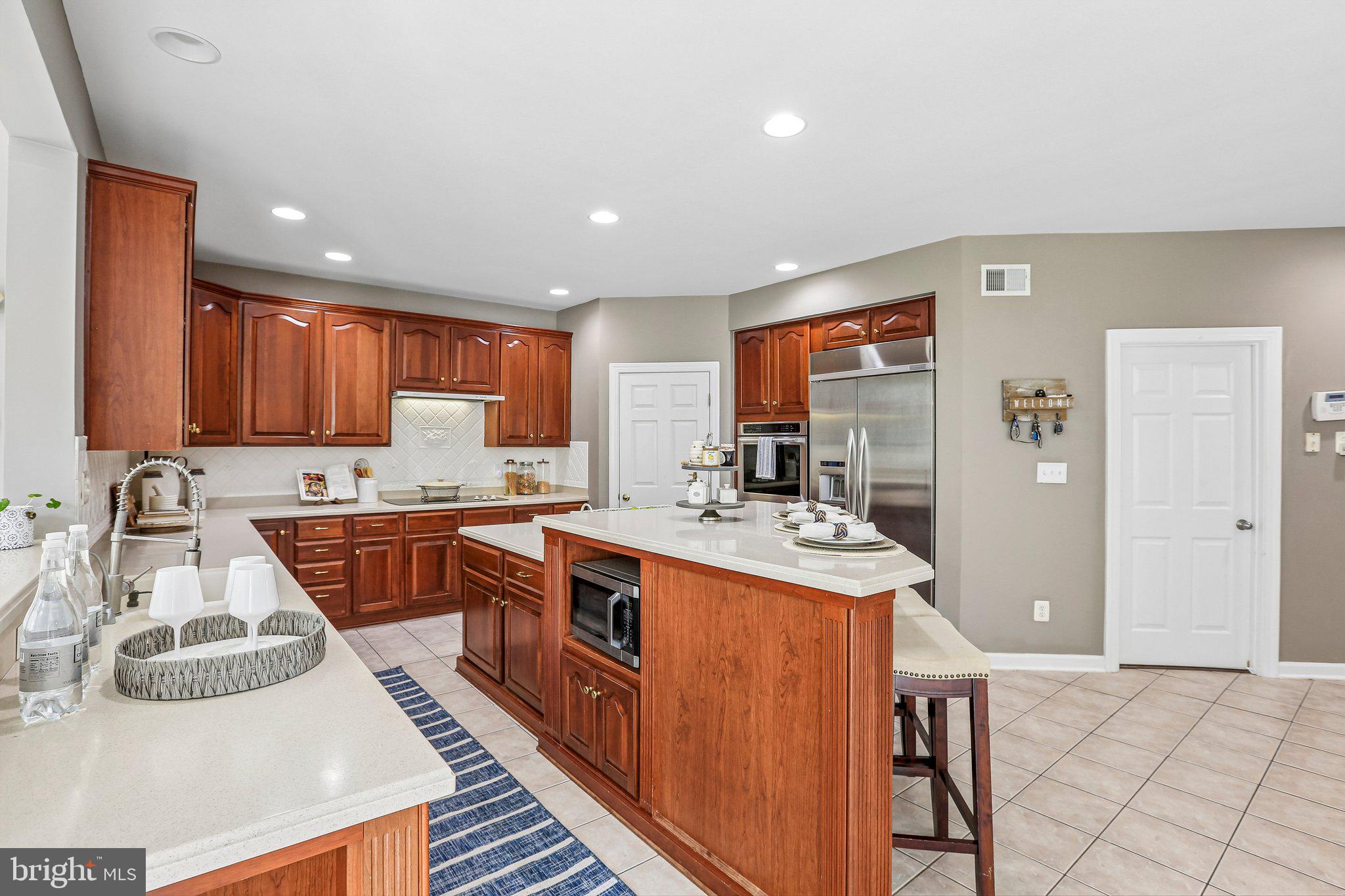 9308 Harrisons Farm Way Gaithersburg, MD 20882 - Photo 13 of 92 Microwave tucked in the island.