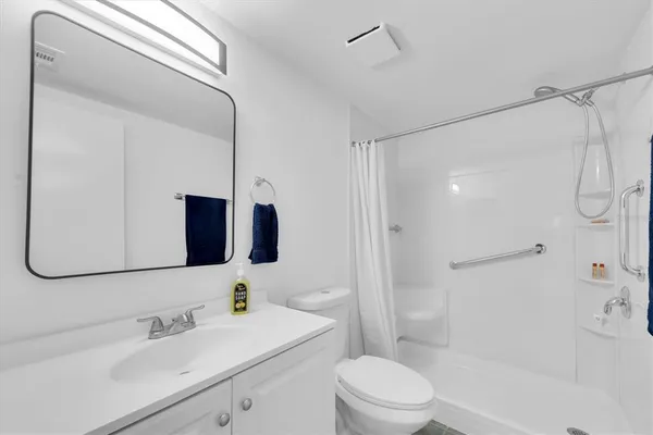 a view of a glass door with a yard from a window