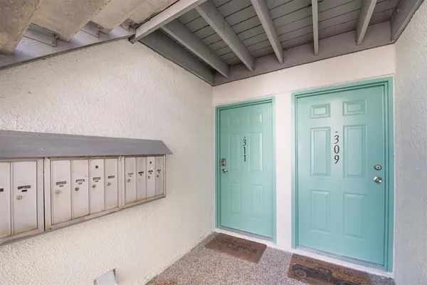 a view of a hallway with entryway