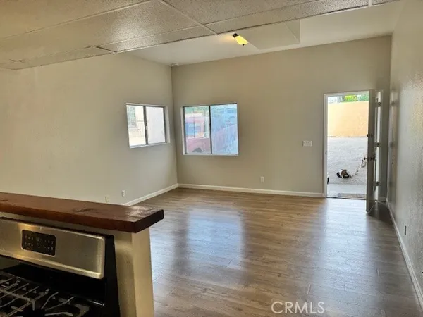 a view of an empty room and wooden floor