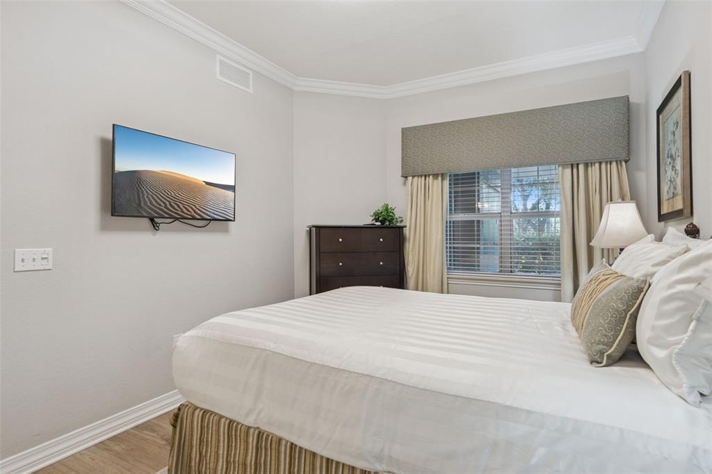 1100 Sunset View Circle, Unit 102 Reunion, FL 34747 - Photo 21 of 67 a bedroom with a bed and window