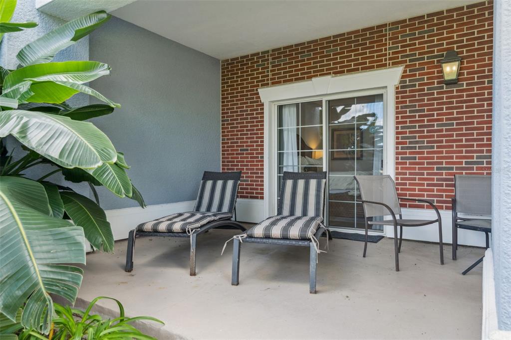 1100 Sunset View Circle, Unit 102 Reunion, FL 34747 - Photo 34 of 67 a view of balcony with chairs and potted plant