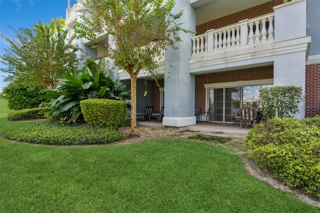 1100 Sunset View Circle, Unit 102 Reunion, FL 34747 - Photo 38 of 67 a view of a house with a yard and plants