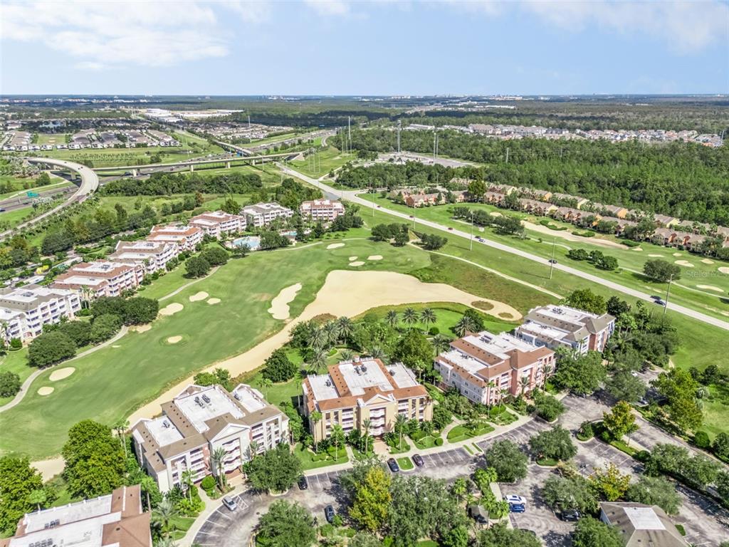 1100 Sunset View Circle, Unit 102 Reunion, FL 34747 - Photo 44 of 67 an aerial view of residential houses with outdoor space and river