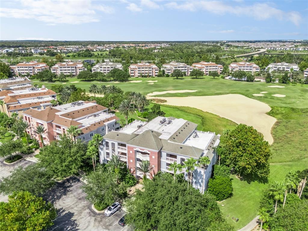 1100 Sunset View Circle, Unit 102 Reunion, FL 34747 - Photo 47 of 67 an aerial view of residential houses with outdoor space and river