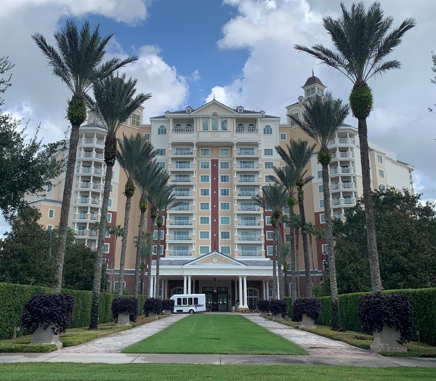 1100 Sunset View Circle, Unit 102 Reunion, FL 34747 - Photo 50 of 67 a view of a big building with a yard and plants