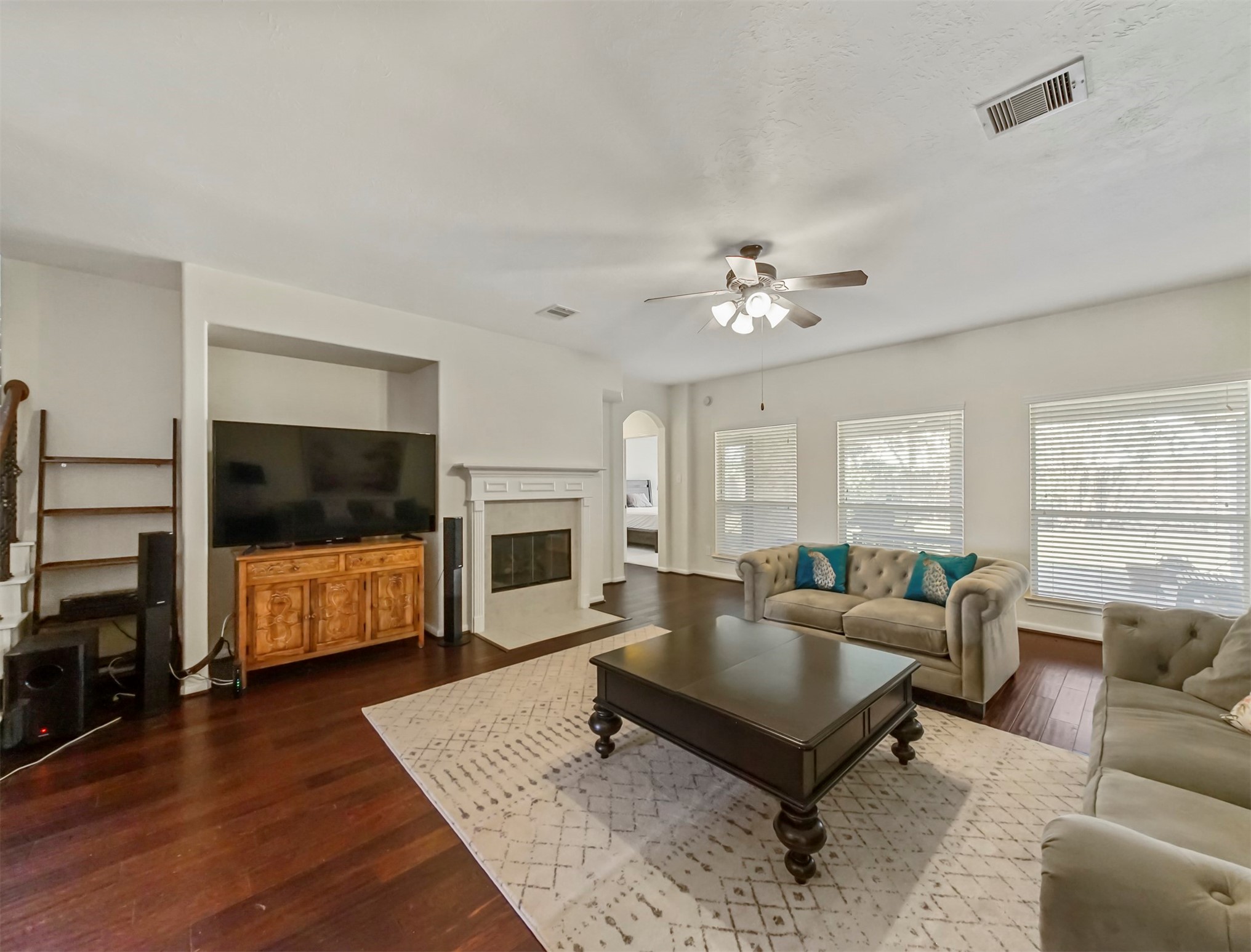 8214 Garrison Point Drive Houston, TX 77040 - Photo 10 of 37 a living room with furniture and a flat screen tv