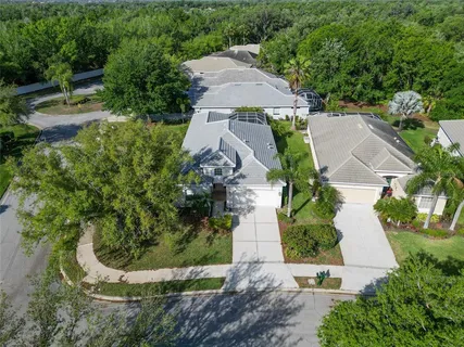 an aerial view of a house with outdoor space and street view