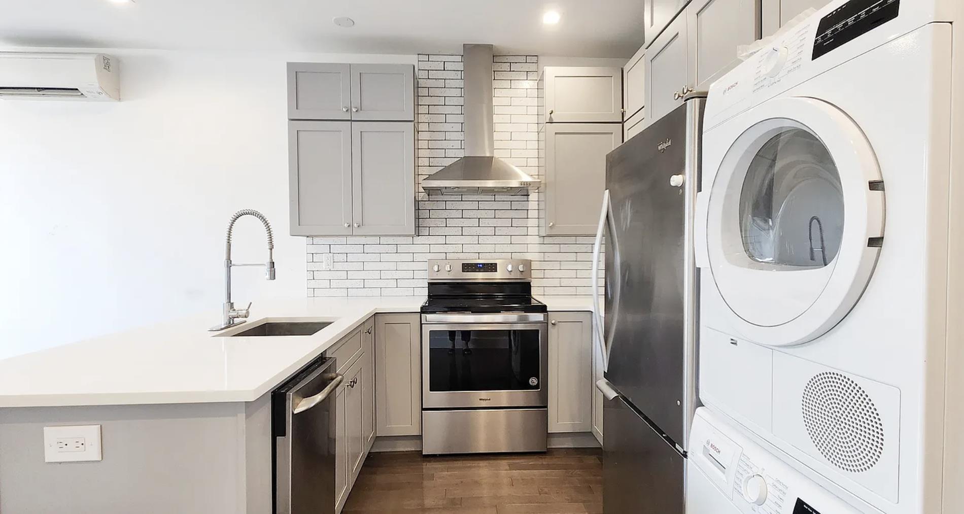 188 Butler Street Brooklyn, NY 11217 - Photo 2 of 12 a kitchen with stainless steel appliances granite countertop a sink and a stove