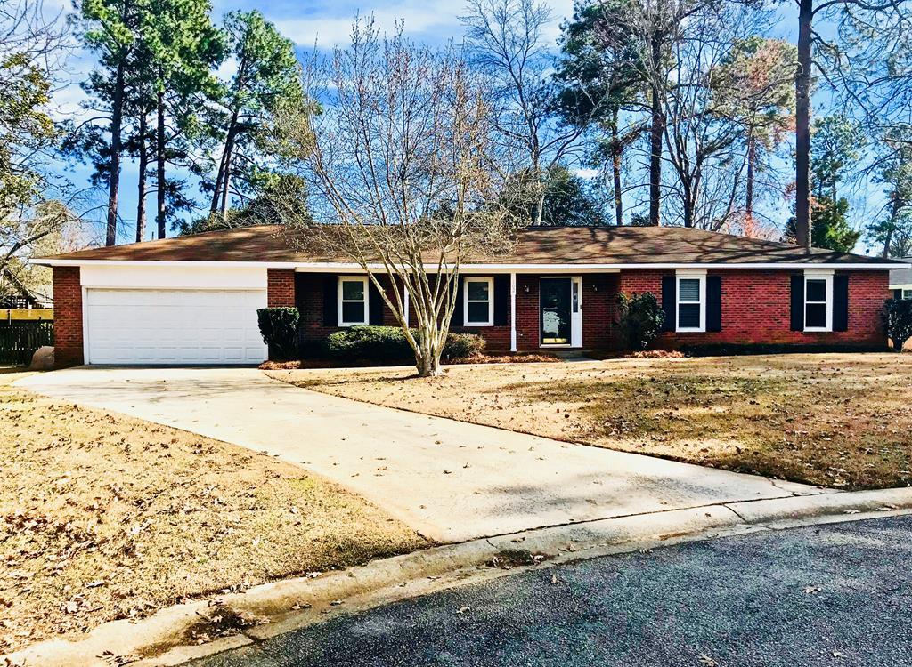 102 Valley Ridge Drive Perry, GA 31069 - Photo 1 of 25 a front view of a building with a garden