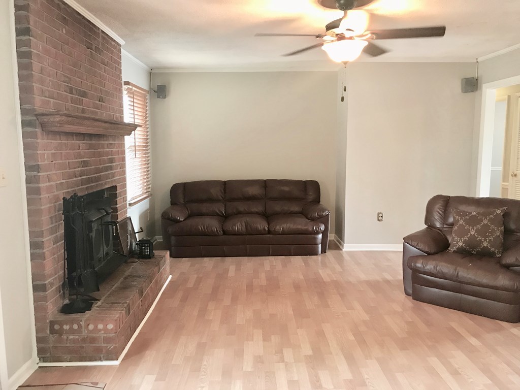 102 Valley Ridge Drive Perry, GA 31069 - Photo 11 of 25 a living room with furniture and a fireplace