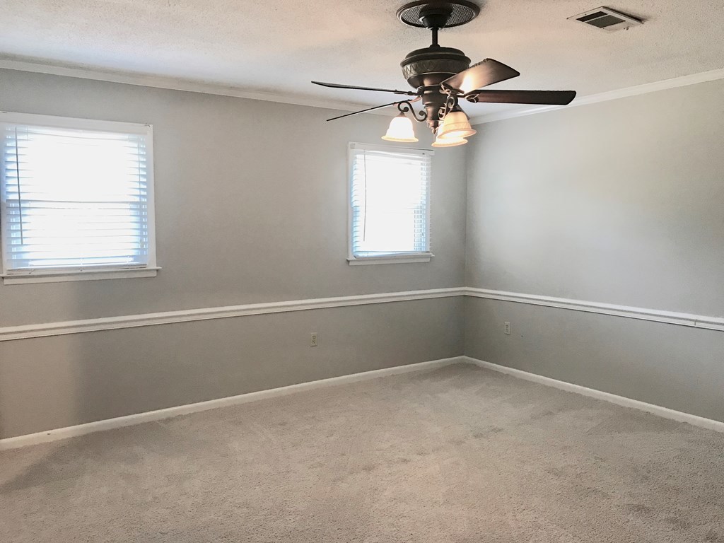 102 Valley Ridge Drive Perry, GA 31069 - Photo 18 of 25 wooden floor in an empty room with a window