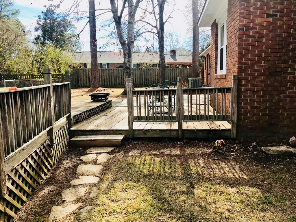 102 Valley Ridge Drive Perry, GA 31069 - Photo 24 of 25 a view of a roof deck with wooden fence and floor