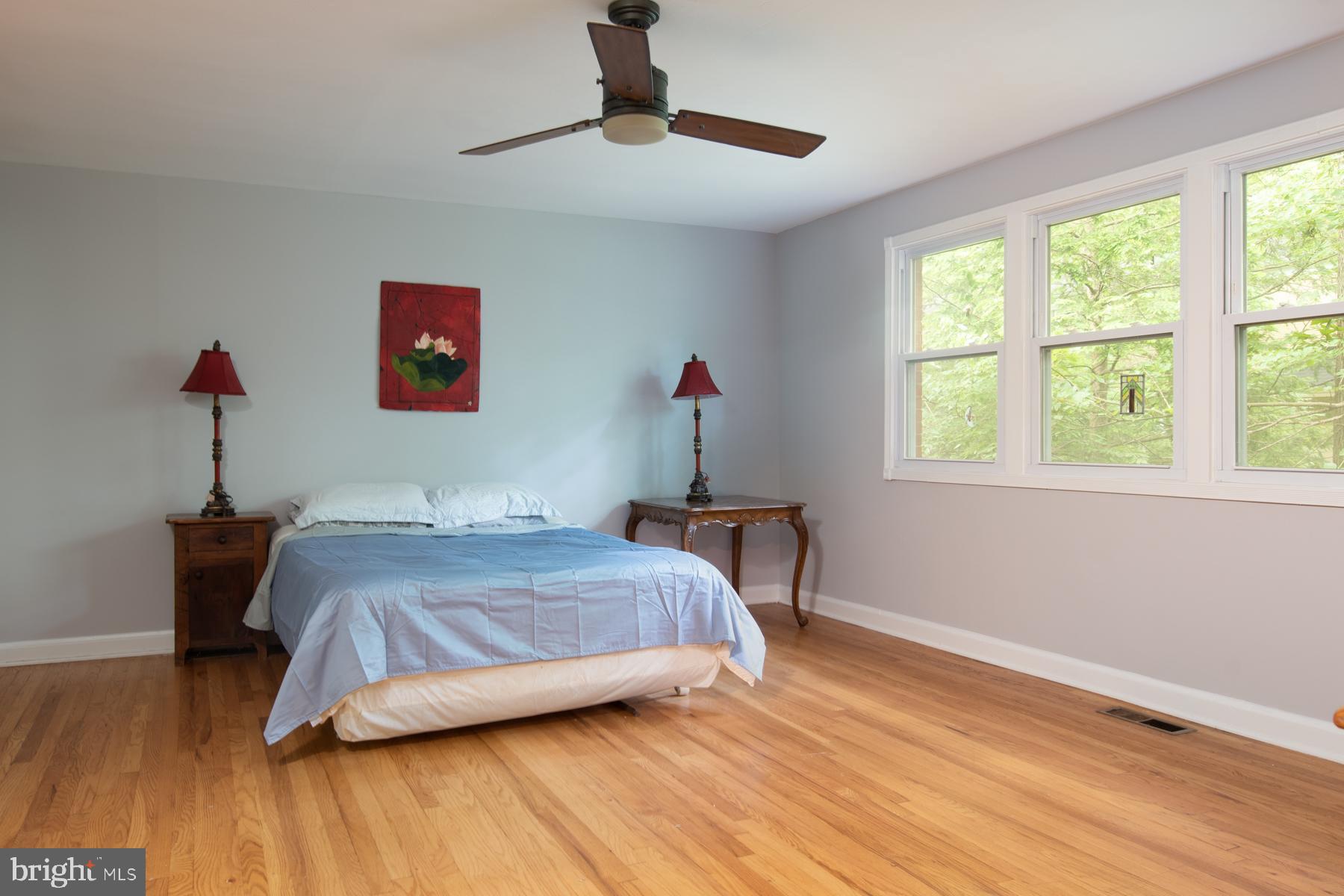 8603 Bradford Road, Unit 105 Silver Spring, MD 20901 - Photo 15 of 36 a bedroom with a bed and a window