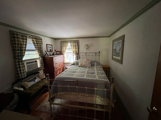 60 R Carol Lane Oak Bluffs, MA 02557 - Photo 11 of 14 a bedroom with a bed and wooden floor